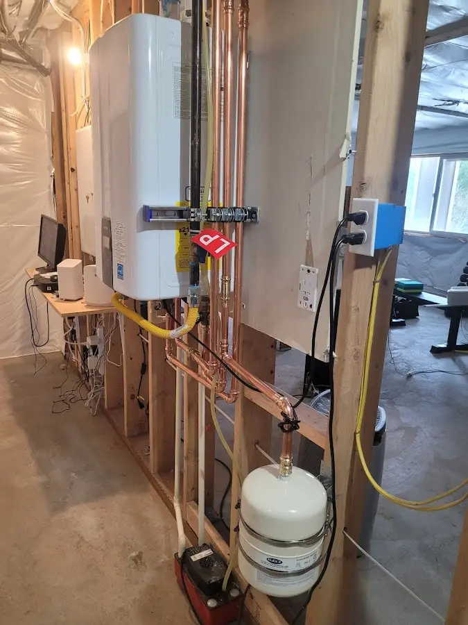 Licensed plumber repairing a kitchen sink in Kalamazoo
